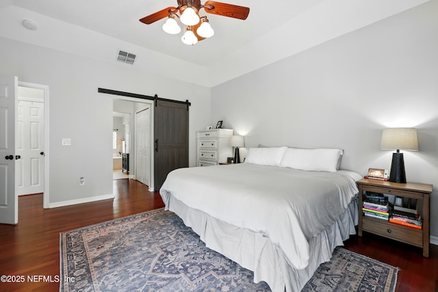 100 Bracken Ct, Saint Johns, FL 32259 - bedroom with a barn door, wood finished floors, baseboards, and ceiling fan