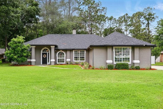100 Bracken Ct, Saint Johns, FL 32259 - ranch-style house with a shingled roof, stucco siding, and a front yard