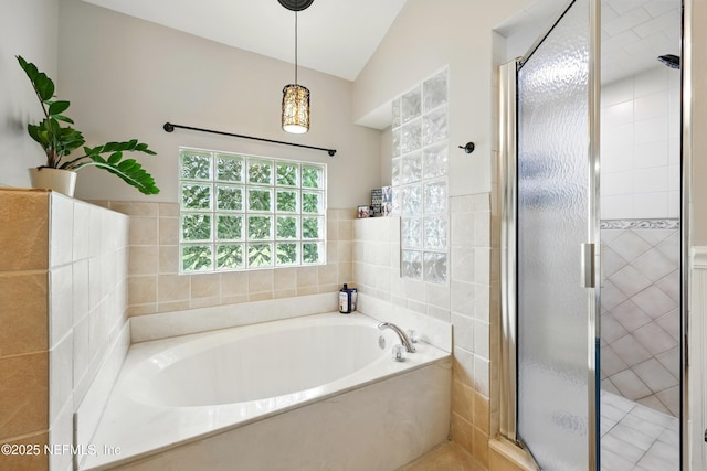 100 Bracken Ct, Saint Johns, FL 32259 - full bathroom featuring a bath, a stall shower, vaulted ceiling, and tile walls