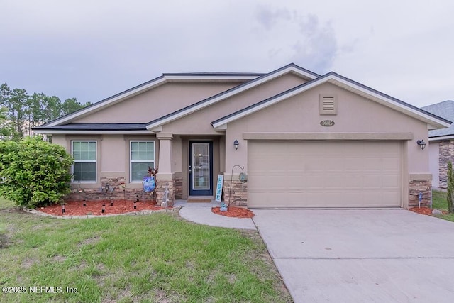single story home featuring stone siding, stucco siding, an attached garage, concrete driveway, and a front yard