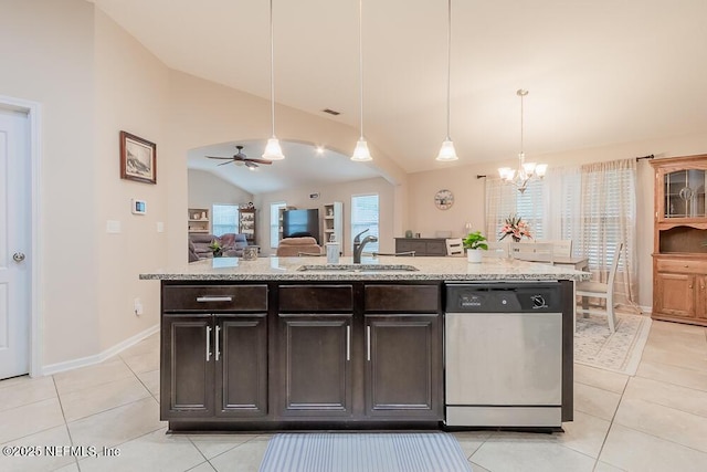 kitchen featuring stainless steel dishwasher, vaulted ceiling, a sink, a chandelier, and ceiling fan