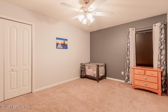 carpeted bedroom with baseboards and ceiling fan