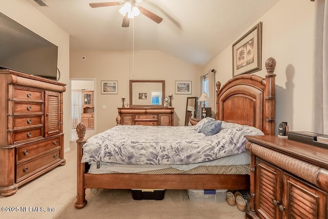 bedroom featuring lofted ceiling, light carpet, and a ceiling fan