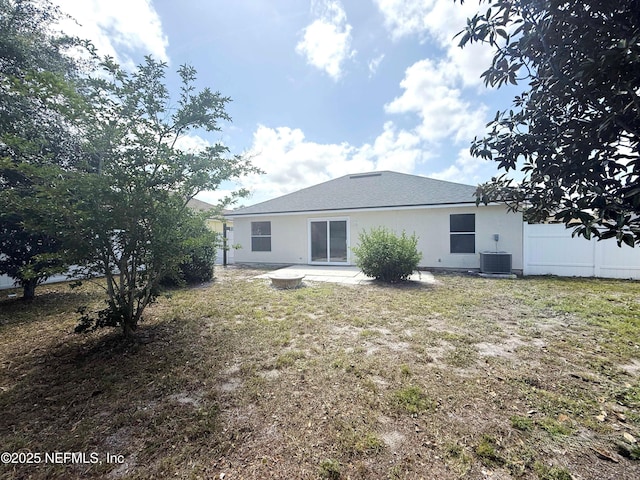rear view of property featuring central AC and a patio