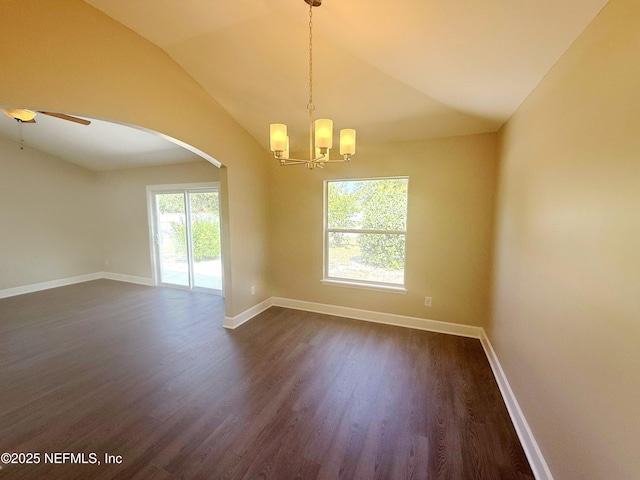 spare room featuring arched walkways, a chandelier, dark wood-type flooring, baseboards, and lofted ceiling