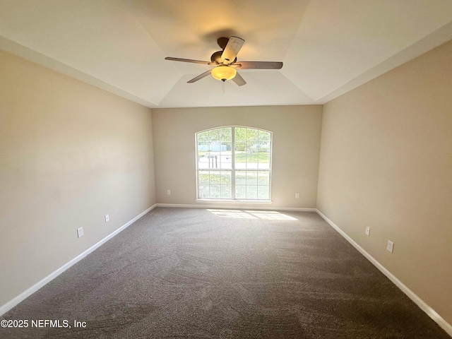 unfurnished room featuring a ceiling fan, carpet flooring, baseboards, and vaulted ceiling