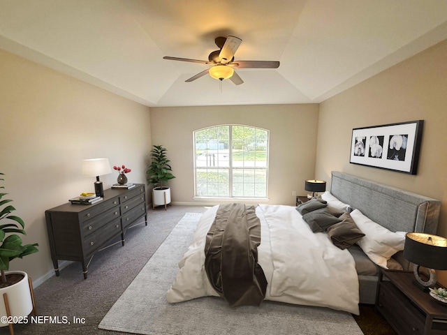 bedroom featuring carpet flooring, vaulted ceiling, a ceiling fan, and baseboards