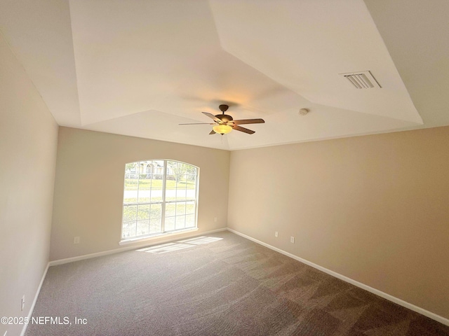 unfurnished room featuring carpet flooring, a ceiling fan, baseboards, and lofted ceiling