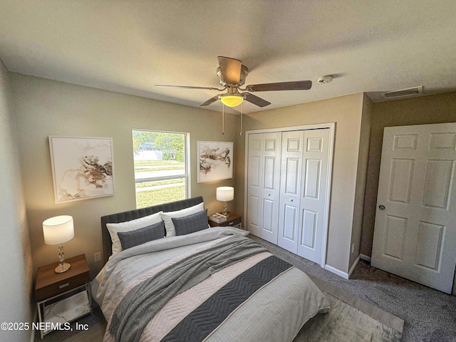 bedroom with a closet, ceiling fan, baseboards, and carpet flooring