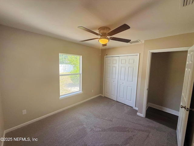 unfurnished bedroom featuring carpet flooring, baseboards, a closet, and ceiling fan