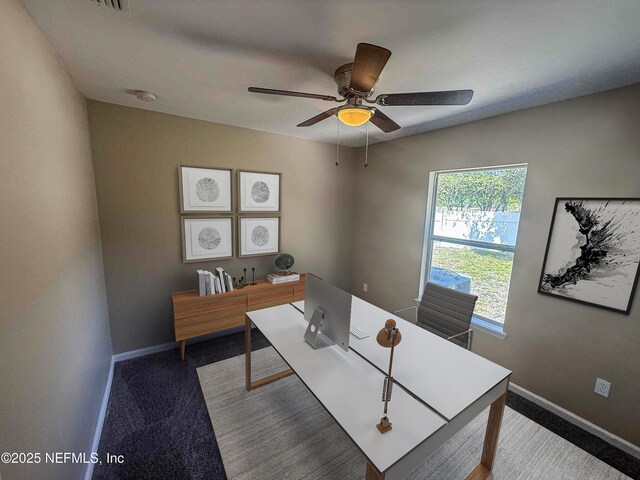home office featuring ceiling fan, carpet floors, and baseboards
