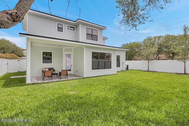 rear view of property featuring a patio
