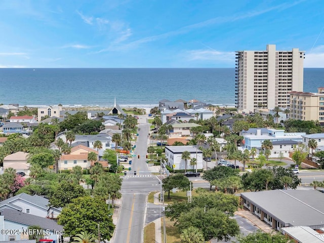 aerial view of residential area featuring a nearby body of water