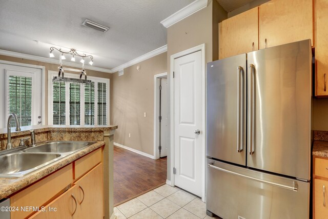 12700 Bartram Park Blvd Unit 123, Jacksonville, FL 32258 - kitchen featuring high quality fridge, a sink, ornamental molding, light tile patterned floors, and a textured ceiling