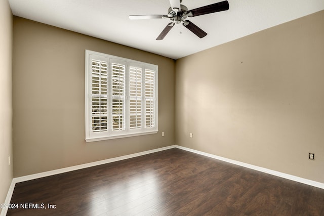 12700 Bartram Park Blvd Unit 123, Jacksonville, FL 32258 - spare room featuring dark wood-style flooring, ceiling fan, and baseboards