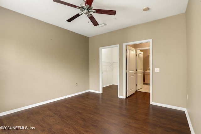 12700 Bartram Park Blvd Unit 123, Jacksonville, FL 32258 - unfurnished bedroom featuring wood finished floors, a walk in closet, baseboards, and a closet
