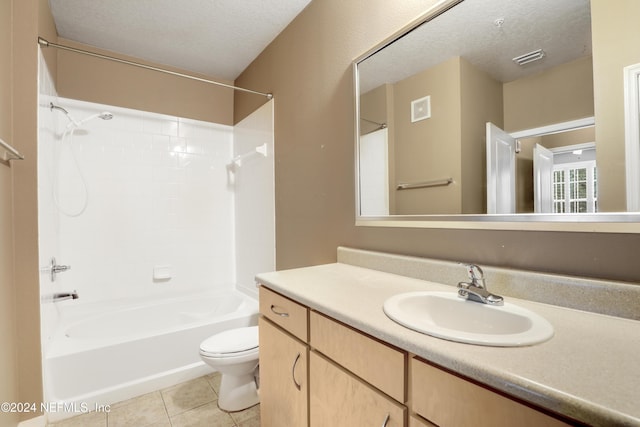 12700 Bartram Park Blvd Unit 123, Jacksonville, FL 32258 - bathroom featuring toilet, tile patterned floors, a textured ceiling,  shower combination, and vanity