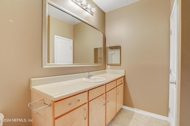 12700 Bartram Park Blvd Unit 123, Jacksonville, FL 32258 - bathroom with vanity, tile patterned floors, and baseboards