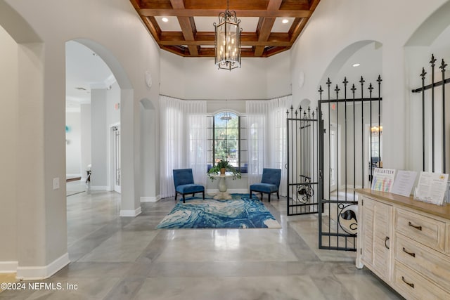 12700 Bartram Park Blvd Unit 123, Jacksonville, FL 32258 - foyer featuring a towering ceiling, beamed ceiling, baseboards, arched walkways, and coffered ceiling