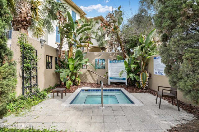 12700 Bartram Park Blvd Unit 123, Jacksonville, FL 32258 - view of swimming pool featuring a community hot tub and fence