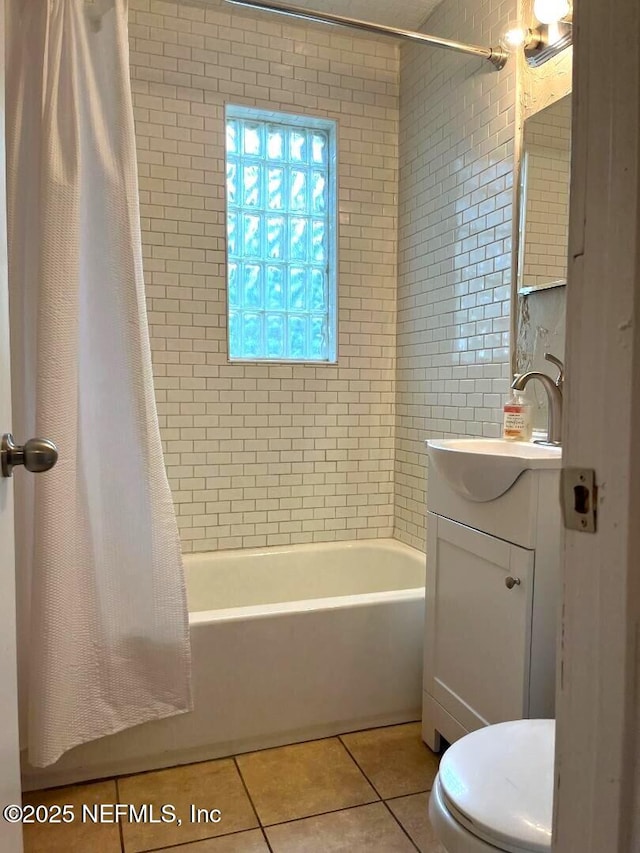 10258 Elmhurst Dr, Jacksonville, FL 32218 - full bathroom with tile patterned flooring, shower / bath combo with shower curtain, toilet, and vanity