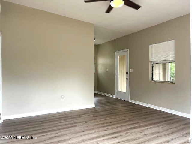 10258 Elmhurst Dr, Jacksonville, FL 32218 - spare room with a ceiling fan, wood finished floors, and baseboards