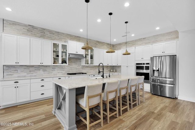 94 Anthem Ridge Dr, Ponte Vedra, FL 32081 - kitchen with stainless steel appliances, a sink, decorative backsplash, hanging light fixtures, and white cabinets