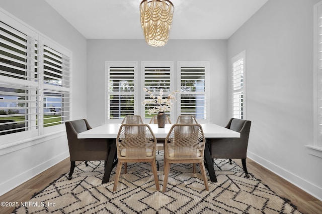 94 Anthem Ridge Dr, Ponte Vedra, FL 32081 - dining space with a chandelier, baseboards, and wood finished floors