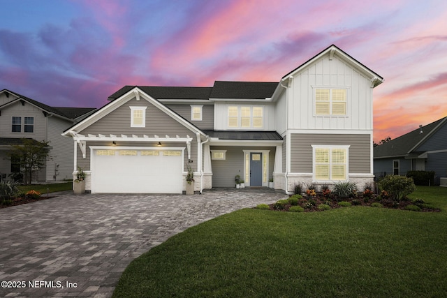 94 Anthem Ridge Dr, Ponte Vedra, FL 32081 - view of front of property featuring decorative driveway, board and batten siding, a standing seam roof, a yard, and metal roof