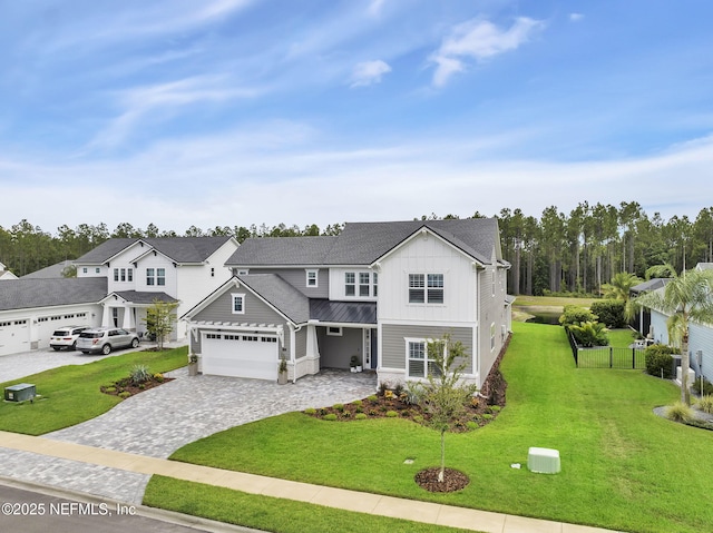 94 Anthem Ridge Dr, Ponte Vedra, FL 32081 - traditional home with a standing seam roof, board and batten siding, decorative driveway, and metal roof