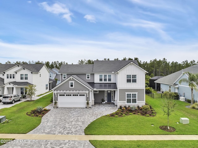 94 Anthem Ridge Dr, Ponte Vedra, FL 32081 - view of front of house with board and batten siding, a standing seam roof, decorative driveway, and a front yard