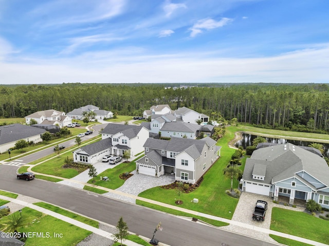 94 Anthem Ridge Dr, Ponte Vedra, FL 32081 - aerial perspective of suburban area featuring a heavily wooded area and a large body of water