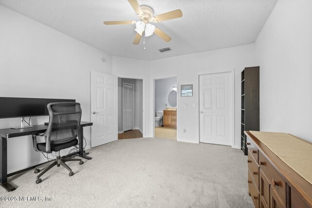 10000 Gate Pkwy Unit 2123, Jacksonville, FL 32246 - office area featuring carpet, ceiling fan, and a textured ceiling