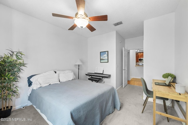10000 Gate Pkwy Unit 2123, Jacksonville, FL 32246 - bedroom featuring light carpet, ceiling fan, and baseboards