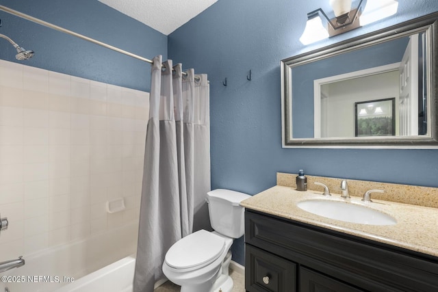 10000 Gate Pkwy Unit 2123, Jacksonville, FL 32246 - bathroom with toilet, shower / bath combo with shower curtain, vanity, and a textured wall