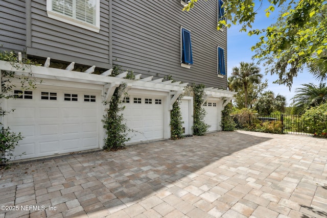 96321 Bay View Dr, Fernandina Beach, FL 32034 - garage with fence and decorative driveway