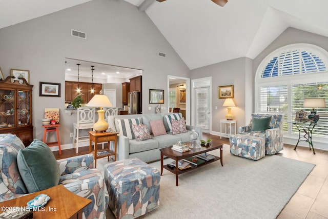 96321 Bay View Dr, Fernandina Beach, FL 32034 - living area featuring high vaulted ceiling, a ceiling fan, and baseboards
