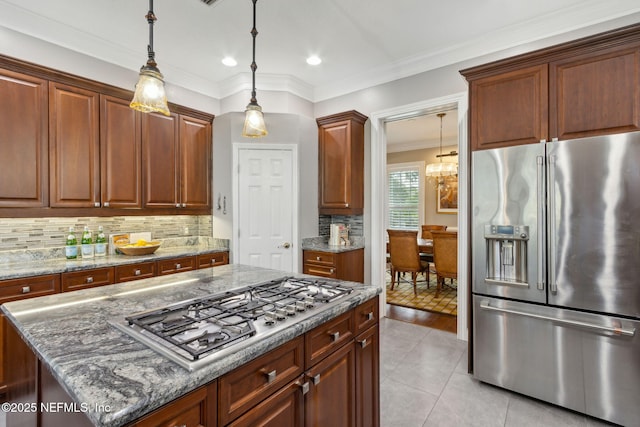 96321 Bay View Dr, Fernandina Beach, FL 32034 - kitchen featuring stainless steel appliances, tasteful backsplash, light tile patterned floors, light stone counters, and recessed lighting