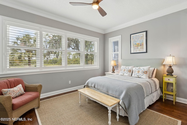 96321 Bay View Dr, Fernandina Beach, FL 32034 - bedroom with crown molding, baseboards, dark wood finished floors, and a ceiling fan