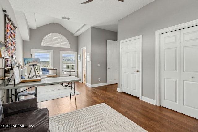 96321 Bay View Dr, Fernandina Beach, FL 32034 - office space with a ceiling fan, dark wood-style floors, lofted ceiling, and baseboards