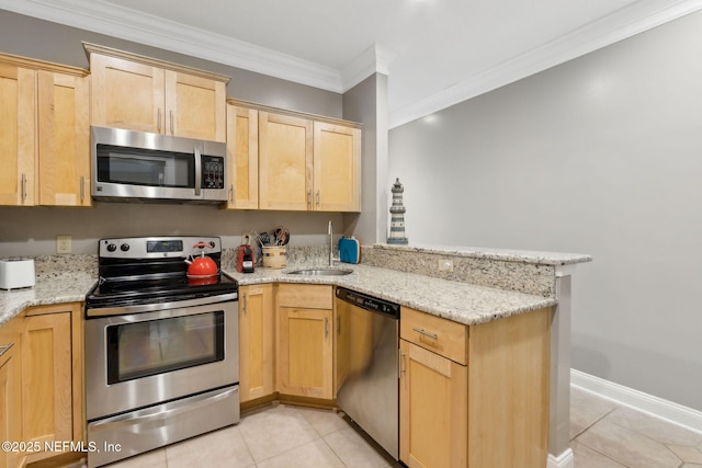 96321 Bay View Dr, Fernandina Beach, FL 32034 - kitchen with appliances with stainless steel finishes, light brown cabinetry, a sink, light tile patterned floors, and a peninsula