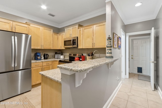 96321 Bay View Dr, Fernandina Beach, FL 32034 - kitchen featuring stainless steel appliances, light brown cabinets, light tile patterned flooring, a peninsula, and recessed lighting
