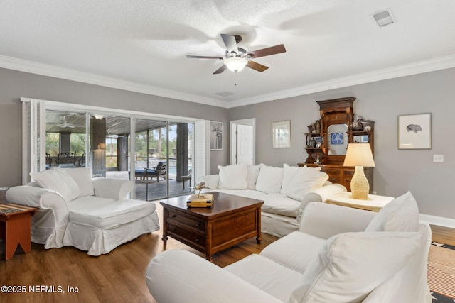 96321 Bay View Dr, Fernandina Beach, FL 32034 - living room with ceiling fan, wood finished floors, and ornamental molding