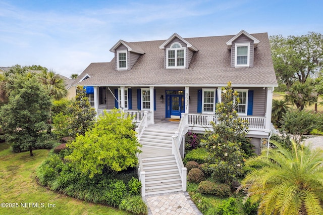 96321 Bay View Dr, Fernandina Beach, FL 32034 - view of front of house with a shingled roof, covered porch, and stairway