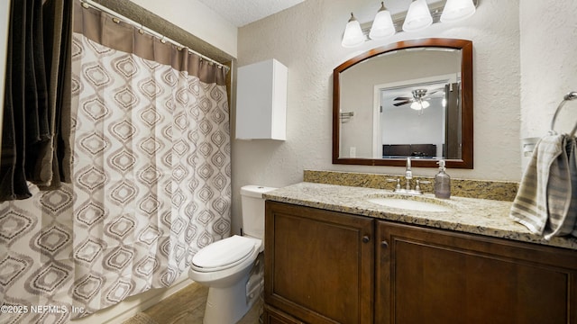 11428 Rustic Pines Cir E, Jacksonville, FL 32257 - full bathroom featuring a textured wall, vanity, toilet, curtained shower, and ceiling fan