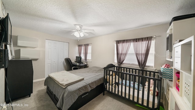 11428 Rustic Pines Cir E, Jacksonville, FL 32257 - bedroom with a closet, carpet floors, a textured ceiling, and a ceiling fan