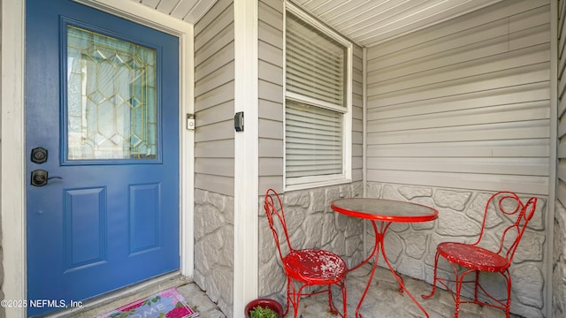 11428 Rustic Pines Cir E, Jacksonville, FL 32257 - view of exterior entry featuring covered porch