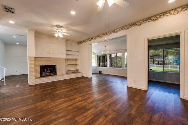5476 Waterside Dr, Jacksonville, FL 32210 - unfurnished living room featuring ceiling fan, dark wood-style flooring, baseboards, a fireplace, and recessed lighting