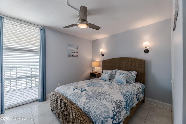 1301 1st St S Unit 1403, Jacksonville Beach, FL 32250 - bedroom with light tile patterned floors, baseboards, and ceiling fan