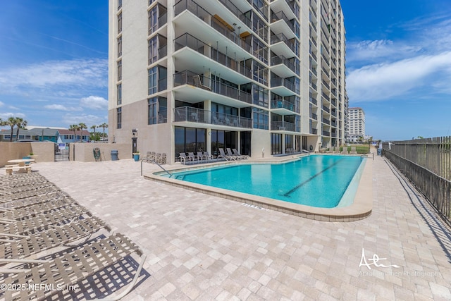 1301 1st St S Unit 1403, Jacksonville Beach, FL 32250 - community pool with fence and a patio area